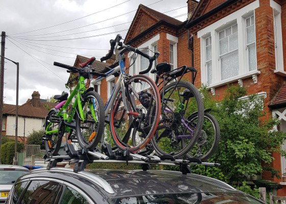 Four bikes on top of a car