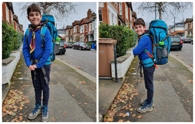 Alex posing with a huge backpack on his back and his Scouting scarf ready to go camping
